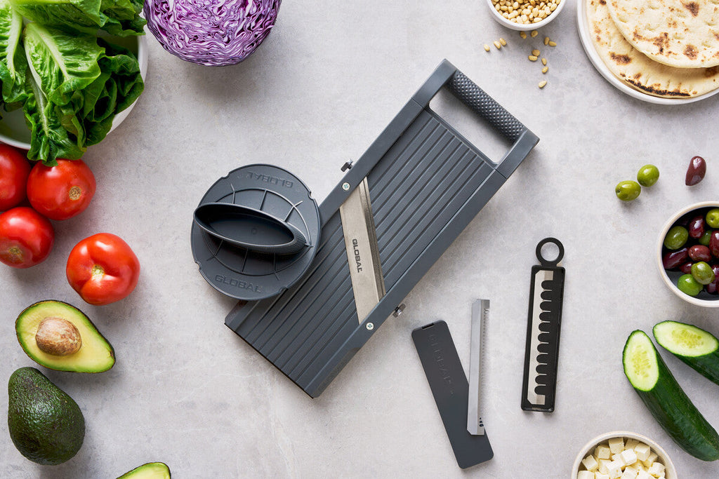 Global's professional mandoline slicer kit with extra slicing blades ns safety hand protector. Blades include mandoline julienne blades, slicing blades and thin shredding blade.