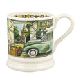 A white ceramic coffee mug featuring a colorful hand-painted illustration of a vintage green car parked in front of a barn with a church steeple in the background.